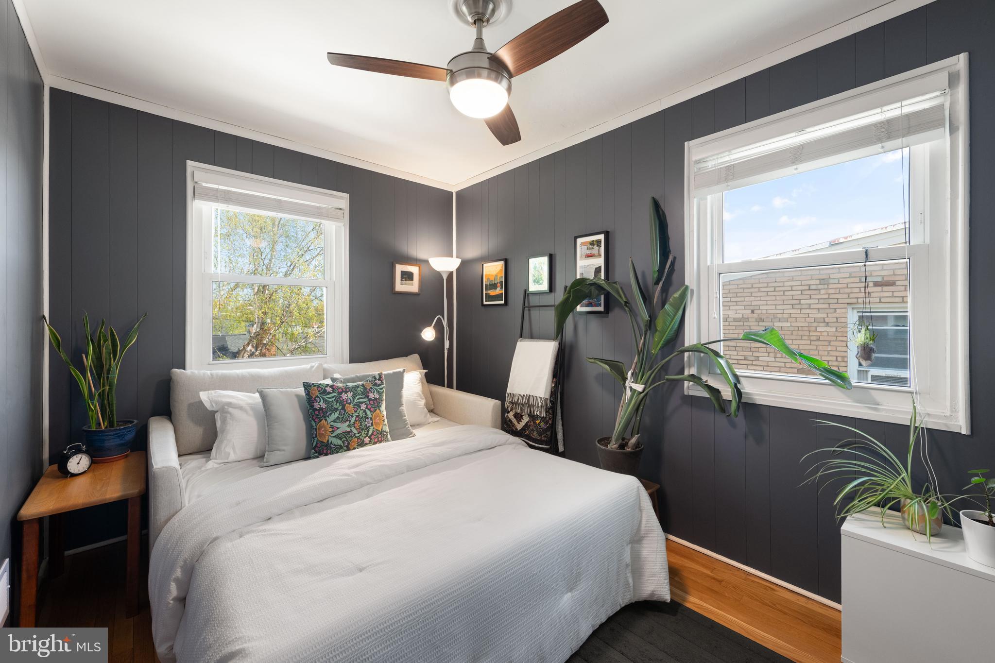 716 Delafield Street Northeast Washington, DC 20017 - Photo 22 of 32 a bedroom with a balcony a bed and a window