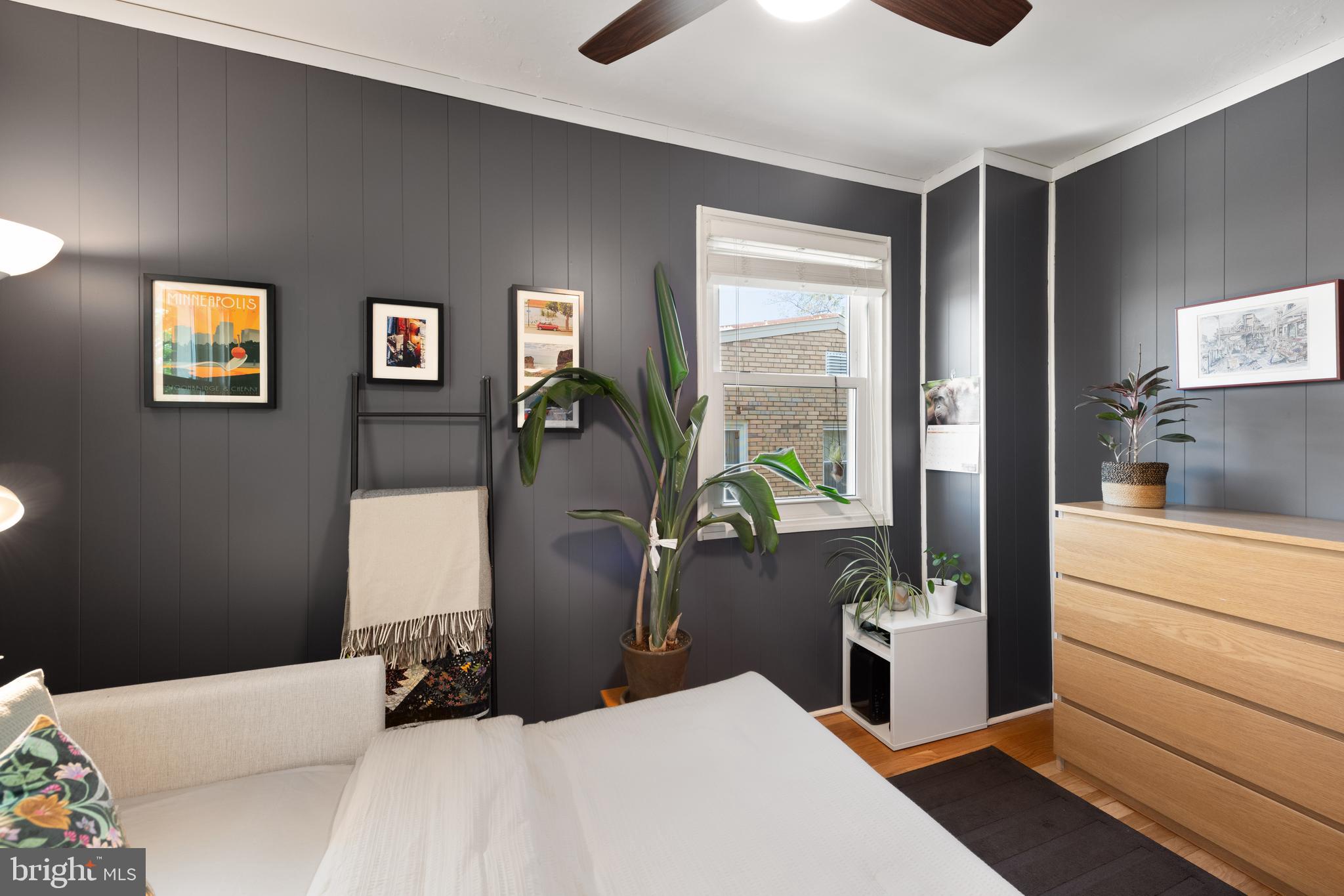 716 Delafield Street Northeast Washington, DC 20017 - Photo 23 of 32 a bedroom with a bed and glass door