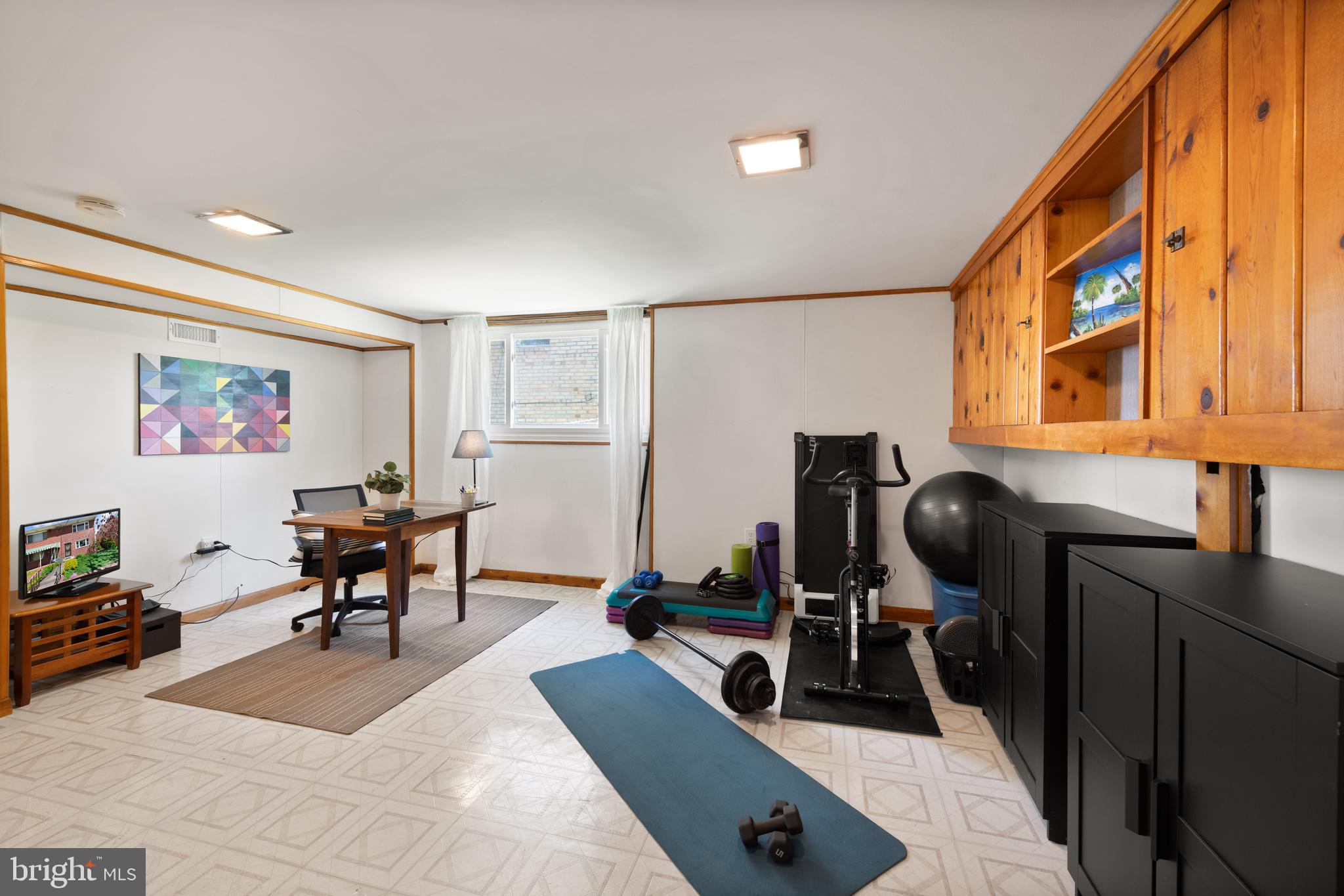 716 Delafield Street Northeast Washington, DC 20017 - Photo 24 of 32 a living room with furniture flat screen tv and a large window