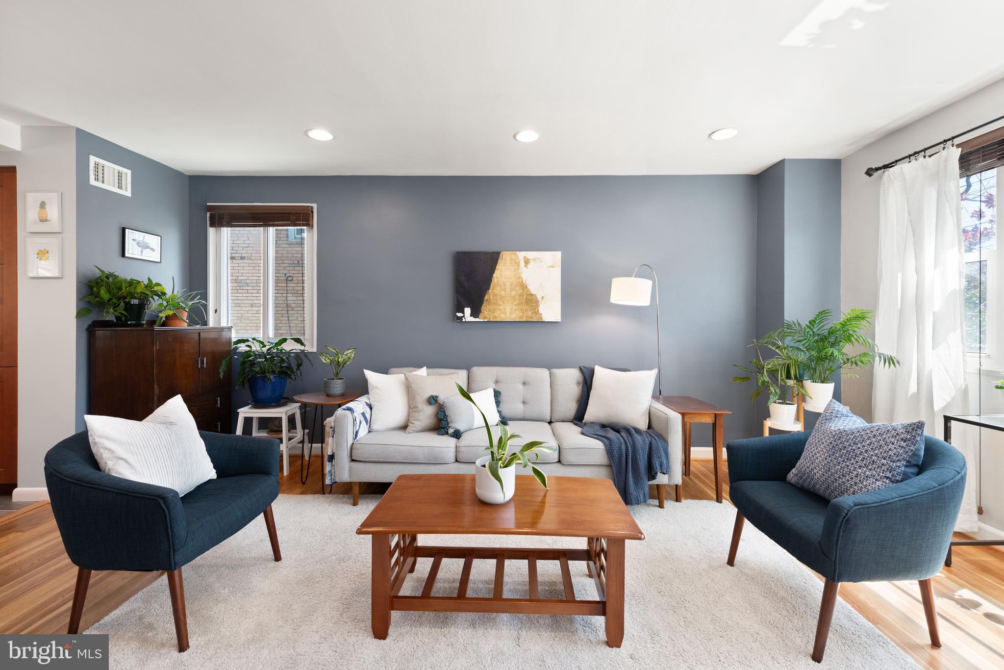 716 Delafield Street Northeast Washington, DC 20017 - Photo 4 of 32 a living room with furniture and a potted plant