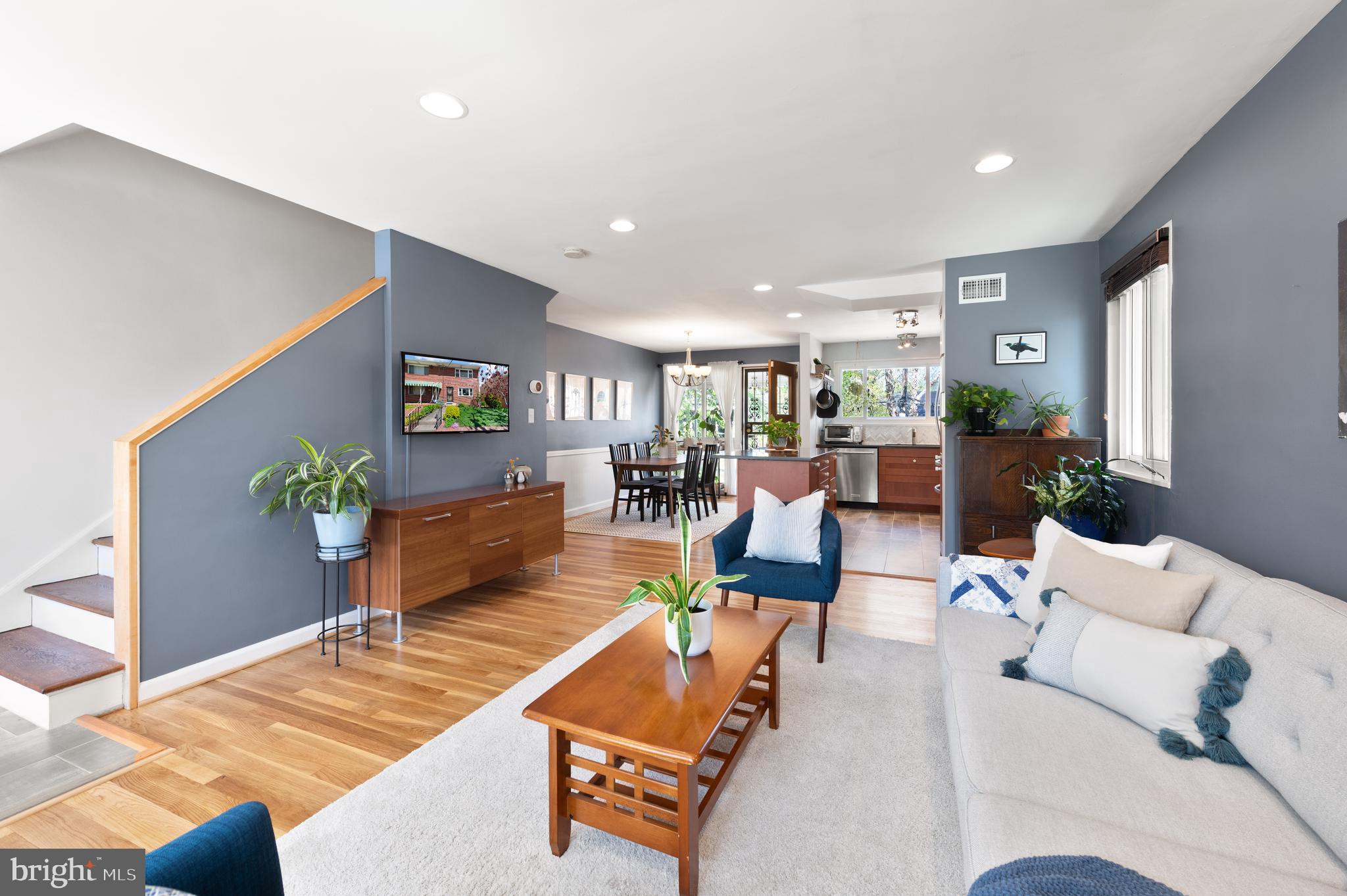 716 Delafield Street Northeast Washington, DC 20017 - Photo 6 of 32 a living room with furniture kitchen view and a potted plant