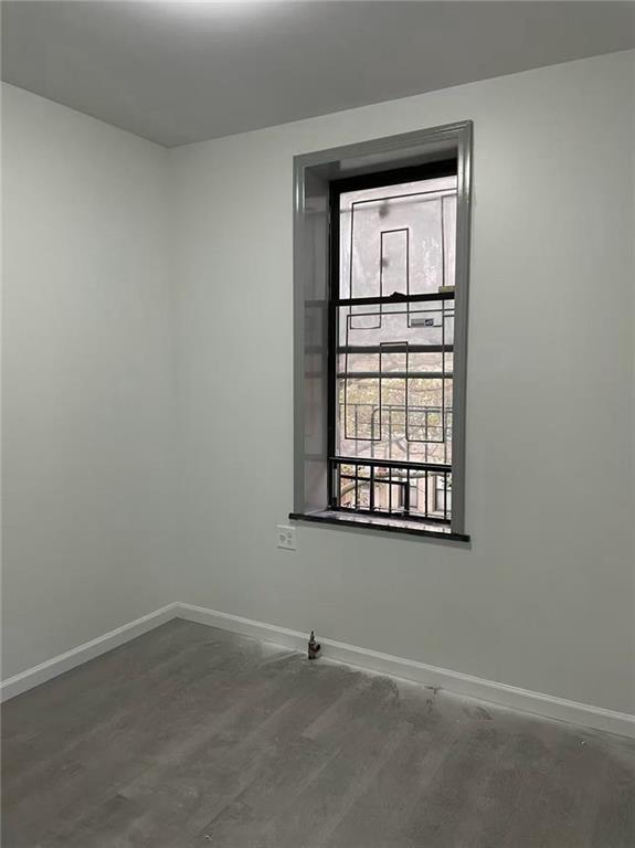 658 46th Street Brooklyn, NY 11220 - Photo 4 of 9 an empty room with a window