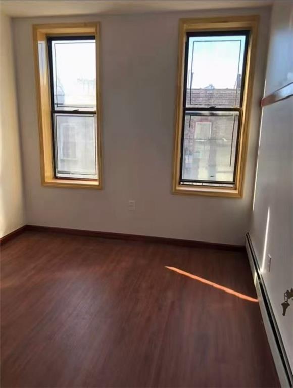 658 46th Street Brooklyn, NY 11220 - Photo 7 of 9 an empty room with windows