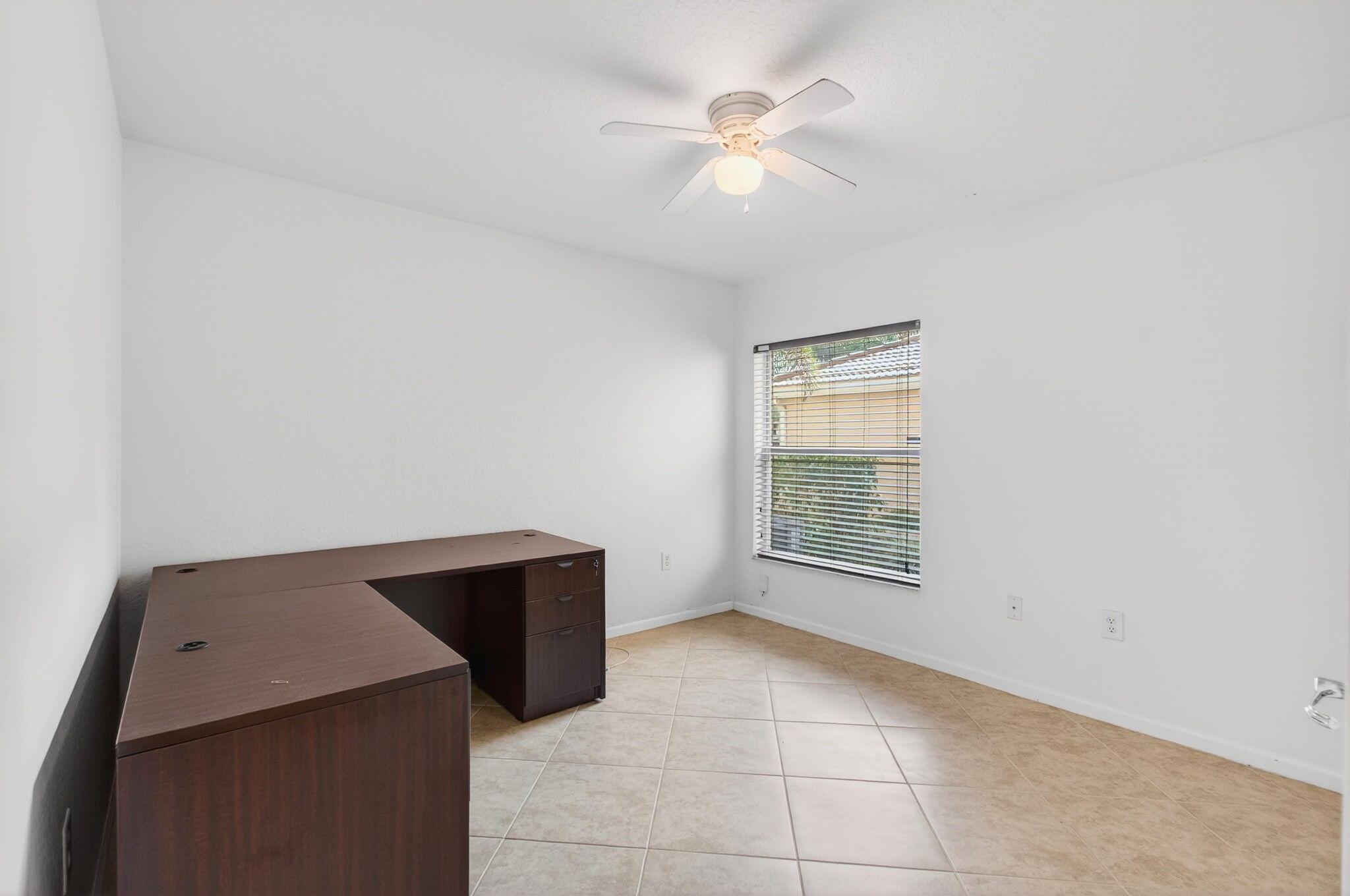 7533 Topiary Avenue Boynton Beach, FL 33437 - Photo 30 of 90 a view of an empty room with a window