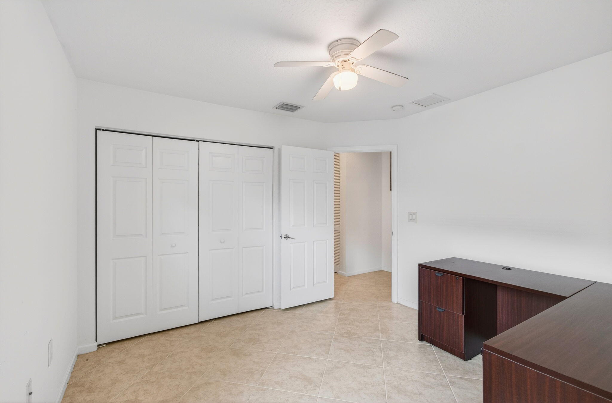 7533 Topiary Avenue Boynton Beach, FL 33437 - Photo 32 of 90 a view of an empty room with chandelier fan