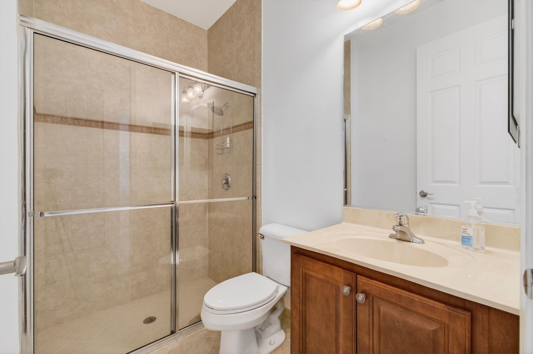 7533 Topiary Avenue Boynton Beach, FL 33437 - Photo 33 of 90 a bathroom with a sink toilet and shower