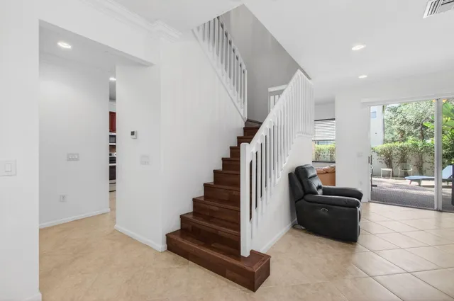 a bathroom with a tub sink a shower and a mirror