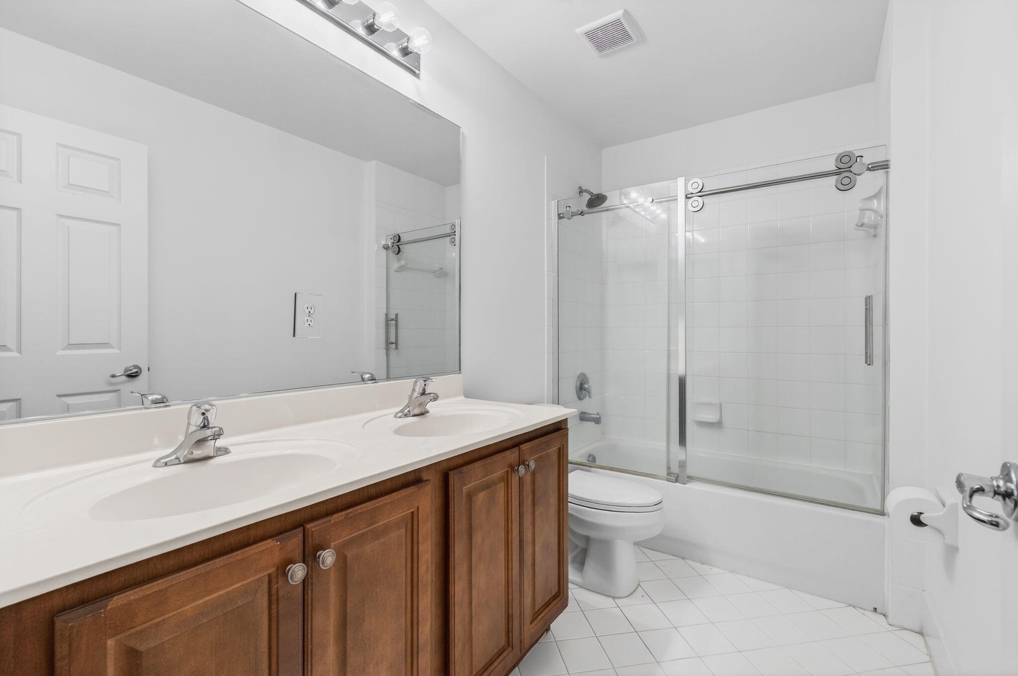 7533 Topiary Avenue Boynton Beach, FL 33437 - Photo 44 of 90 a bathroom with a sink a toilet and shower