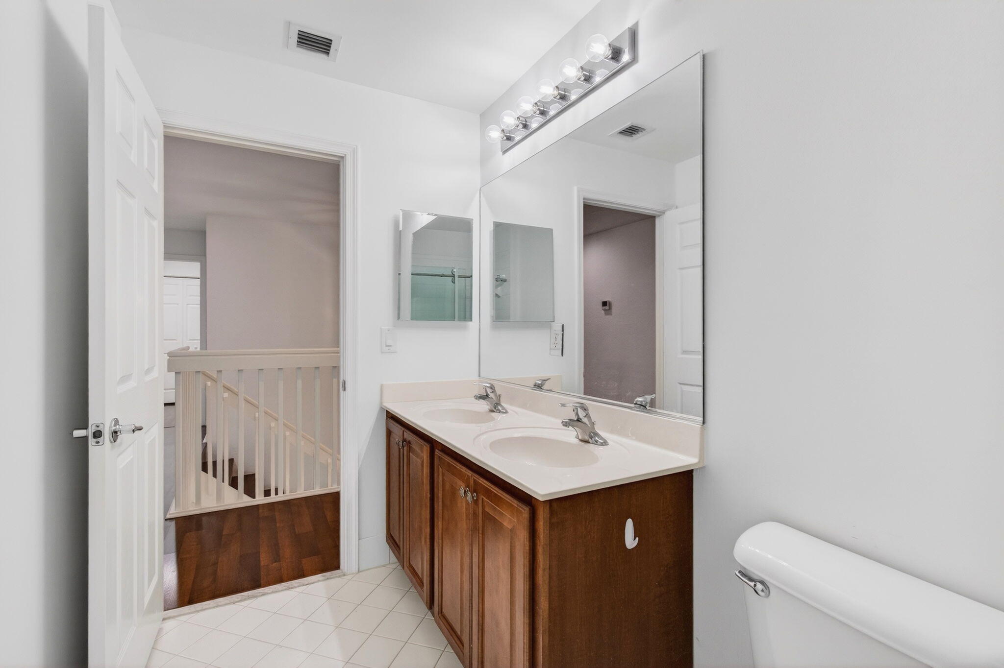 7533 Topiary Avenue Boynton Beach, FL 33437 - Photo 46 of 90 a bathroom with a sink a toilet and shower