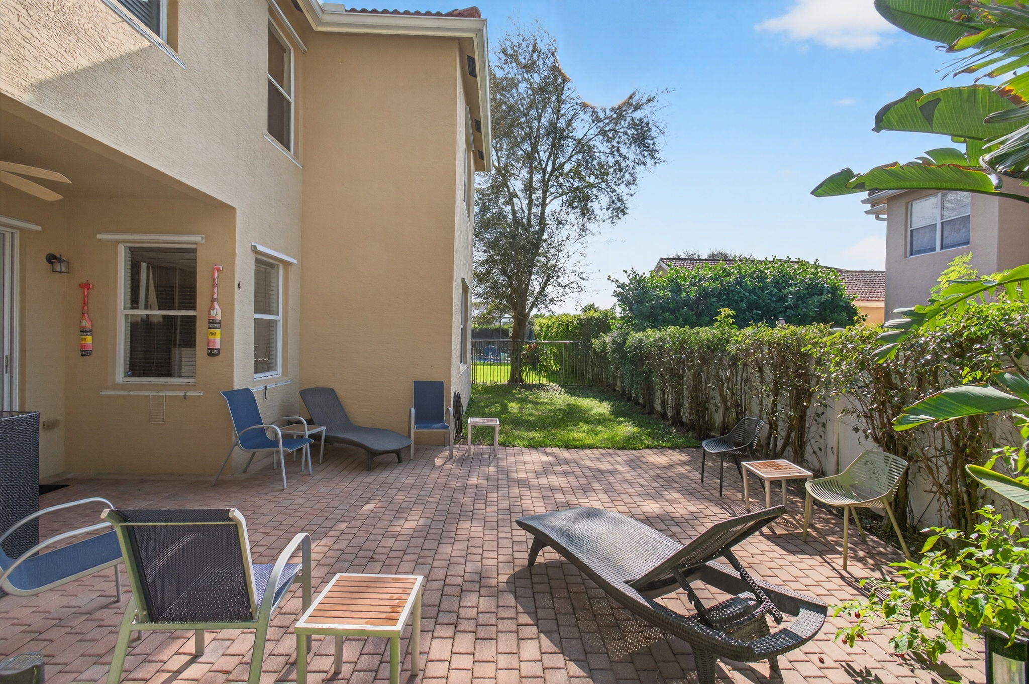 7533 Topiary Avenue Boynton Beach, FL 33437 - Photo 65 of 90 a view of a backyard with sitting area