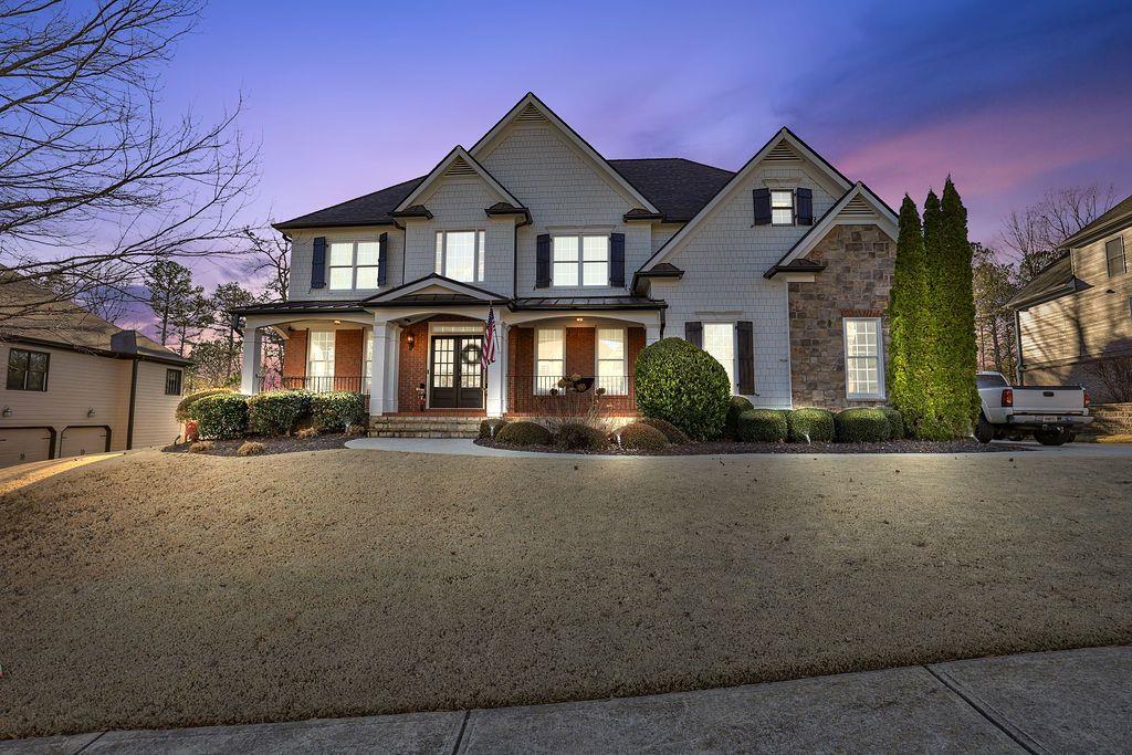 2057 Towne Mill Avenue Canton, GA 30114 - Photo 1 of 1 a front view of a house with a garden