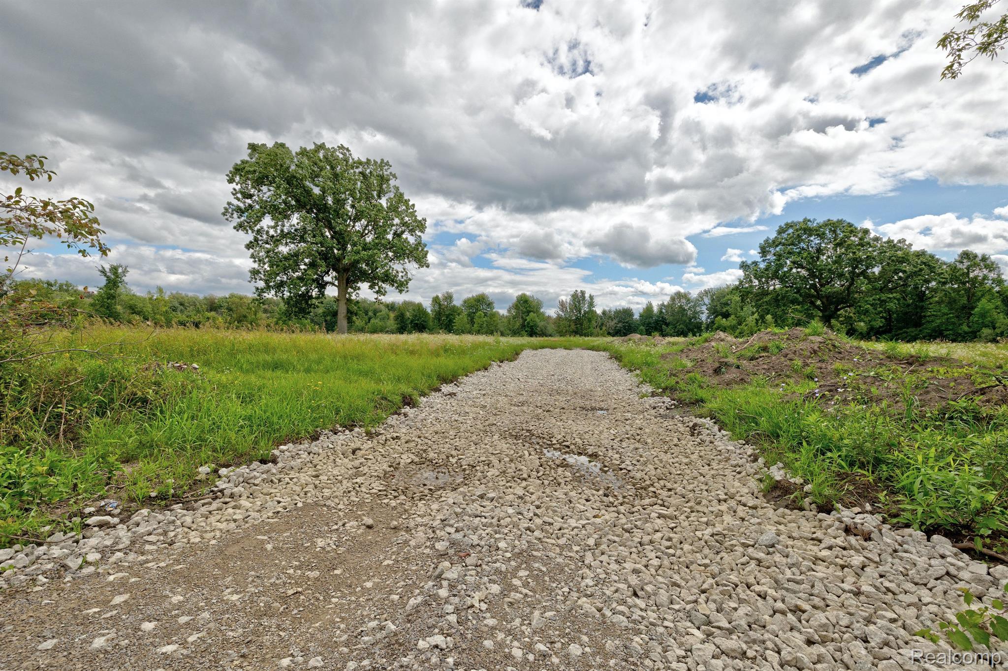 8910 Petz Road Imlay City, MI 48444 - Photo 23 of 62 Area 1 ground level gravel construction driveway