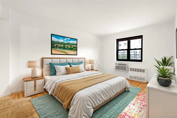 a bedroom with bed and a potted plant