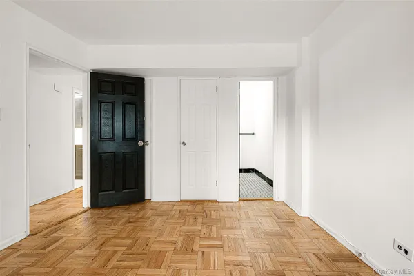 a bathroom with a sink mirror and toilet