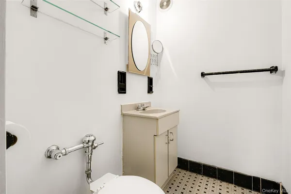 a bedroom with bed and a potted plant