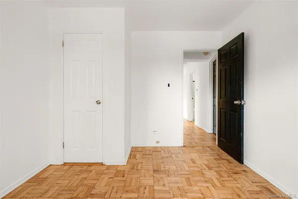 a bathroom with a sink a toilet a mirror and shower