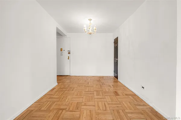 a view of empty room with a fireplace