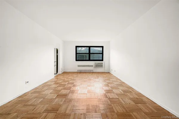 a view of a room with a large window