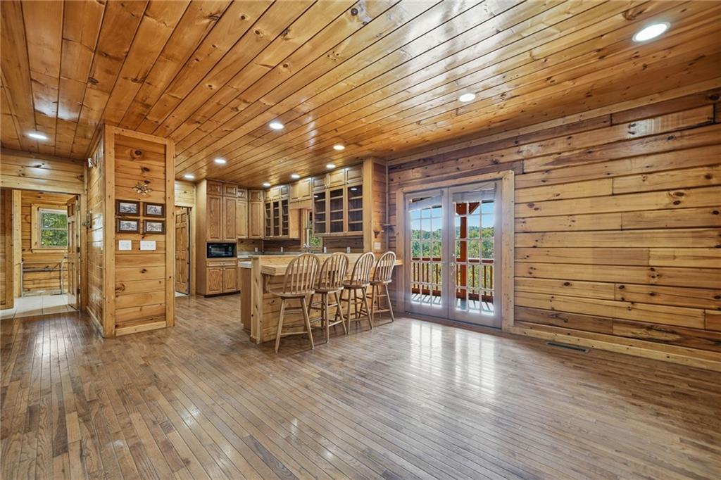 1384 Crystal Lane Northeast Ranger, GA 30734 - Photo 16 of 57 a dining room with furniture wooden floor and kitchen view