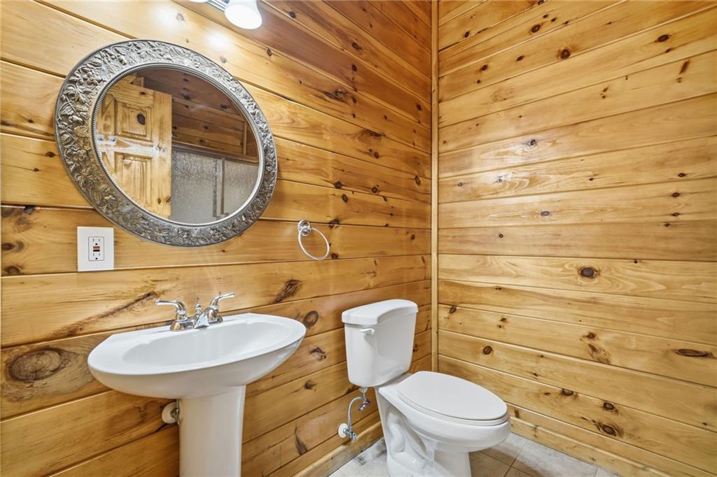 1384 Crystal Lane Northeast Ranger, GA 30734 - Photo 27 of 57 a bathroom with a sink a toilet and a mirror
