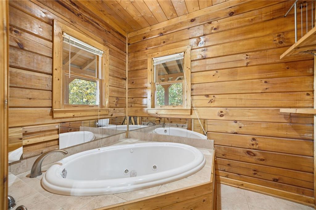 1384 Crystal Lane Northeast Ranger, GA 30734 - Photo 40 of 57 a bathroom with a tub and a sink