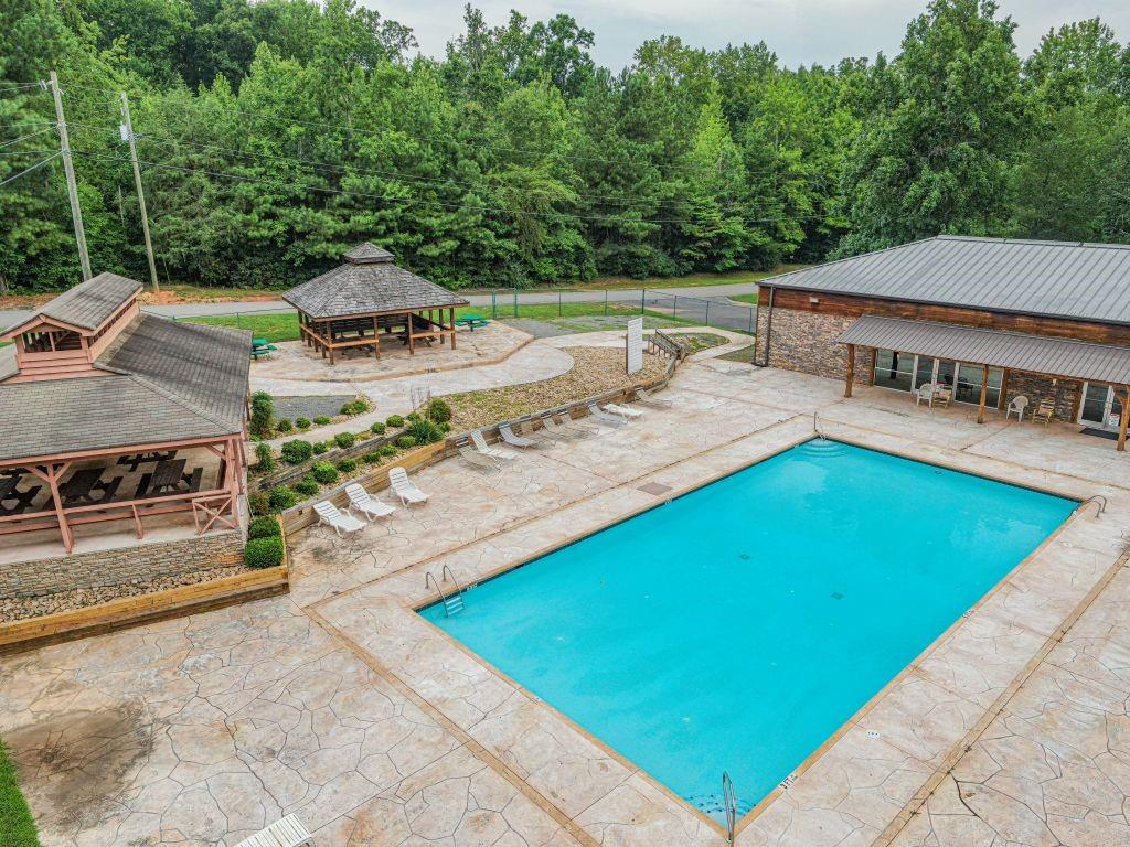 1384 Crystal Lane Northeast Ranger, GA 30734 - Photo 55 of 57 a view of a swimming pool with a patio and a yard