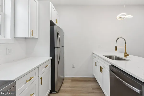 a kitchen with a sink and cabinets