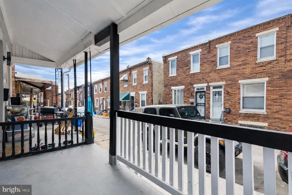 a view of a large brick building from a balcony