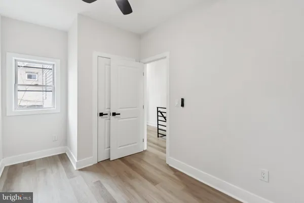 an empty room with wooden floor