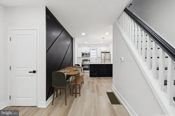 a view of kitchen with microwave and furniture