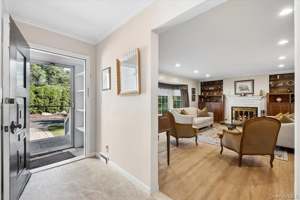 372 Fort Hill Road Scarsdale, NY 10583 - Photo 2 of 40 Entrance foyer opening to sun-filled living room