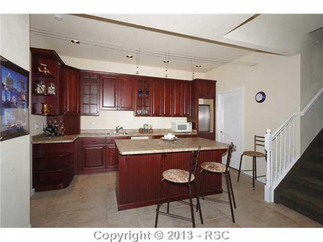 15625 Falcon Ridge Court Colorado Springs, CO 80921 - Photo 17 of 25 Wet Bar is Plumbed for an Ice Maker, Dishwasher & Beverage Chiller. Bar Refrigerator is Included