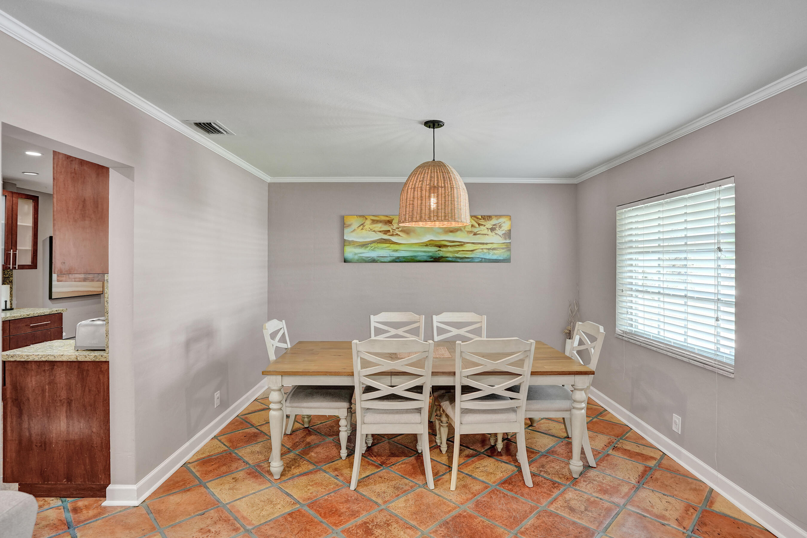 1440 Southeast 4th Court Deerfield Beach, FL 33441 - Photo 12 of 25 a view of a dining room with furniture window and wooden floor