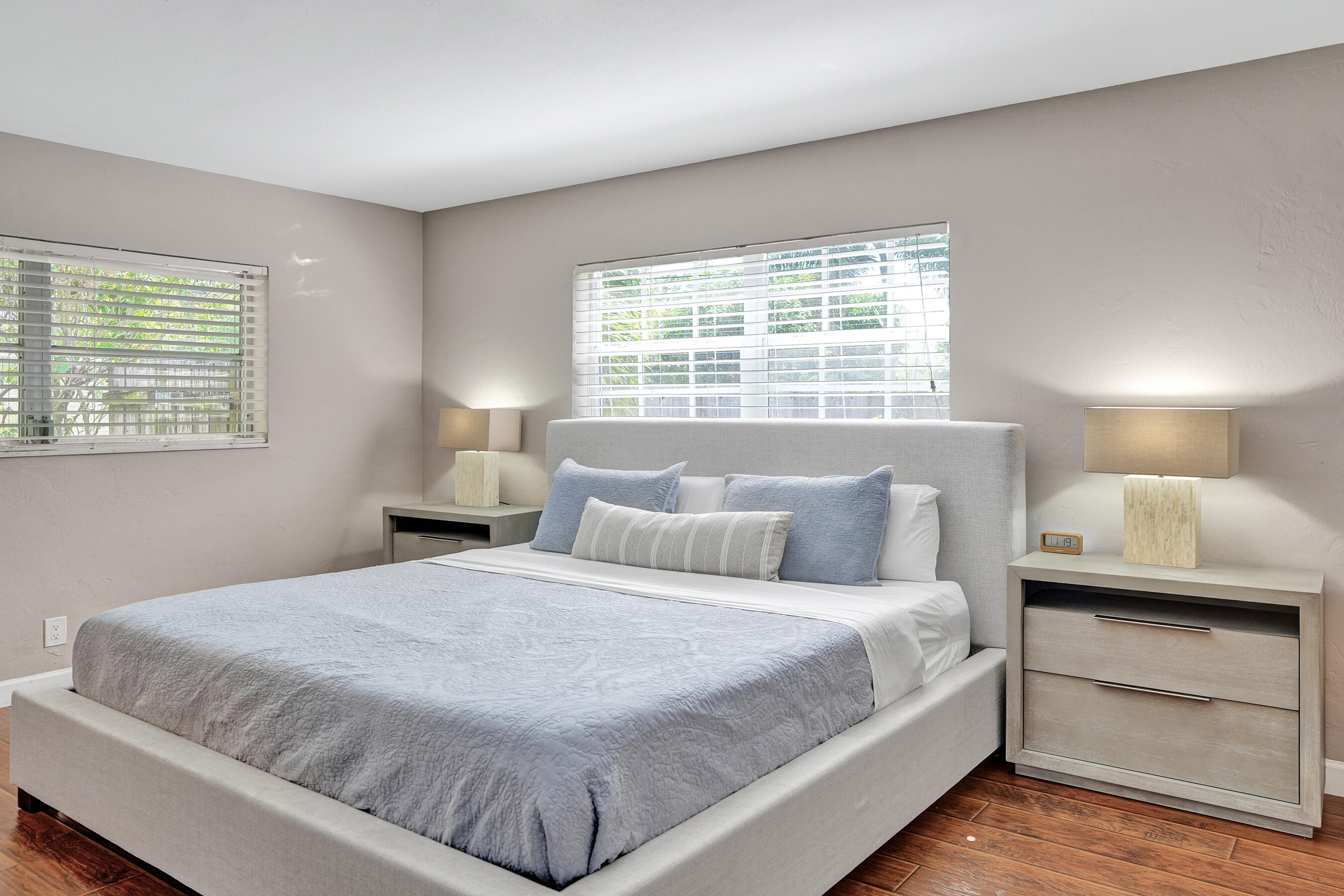 1440 Southeast 4th Court Deerfield Beach, FL 33441 - Photo 13 of 25 a bedroom with a bed and a lamp