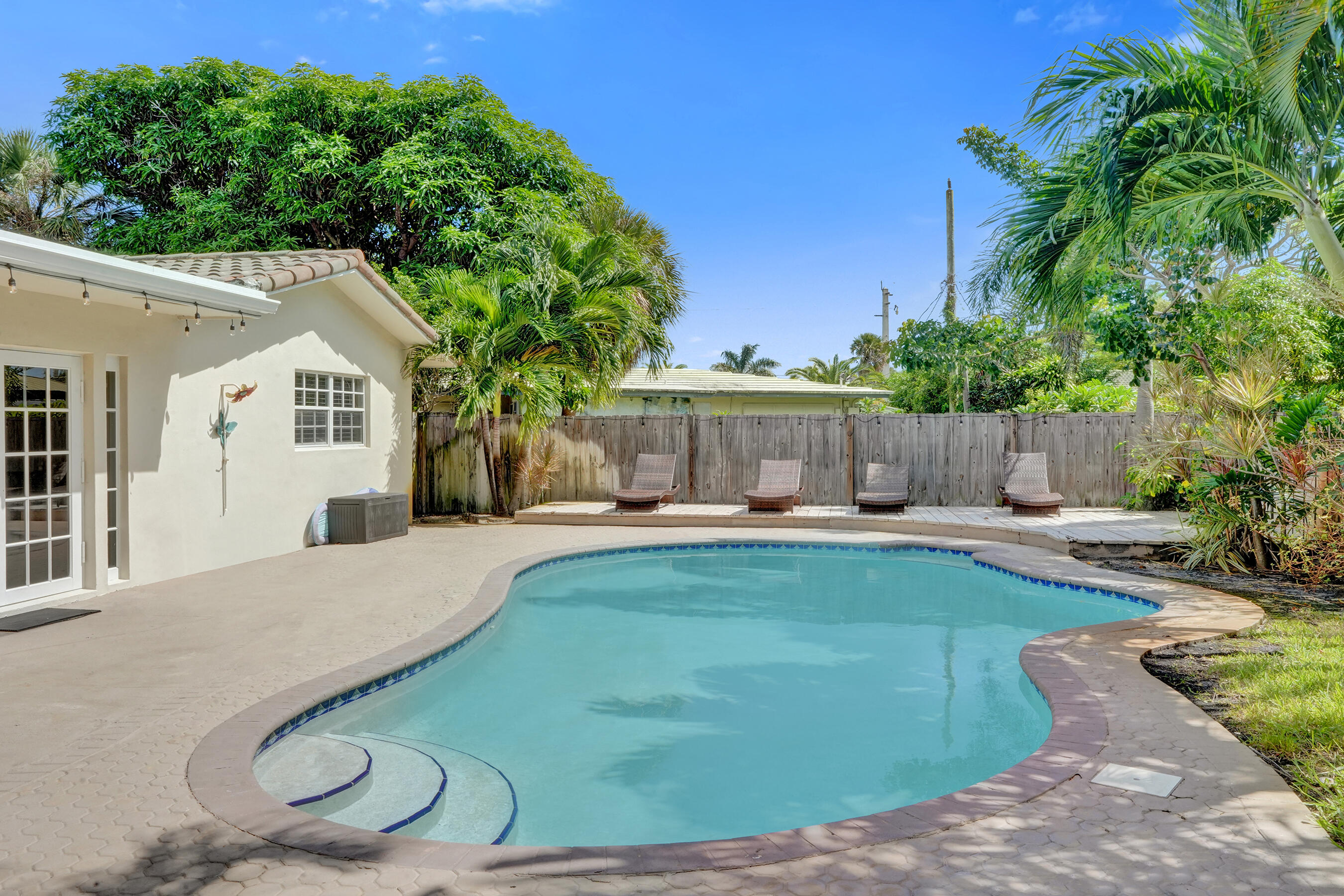 1440 Southeast 4th Court Deerfield Beach, FL 33441 - Photo 21 of 25 a swimming pool with outdoor seating and yard