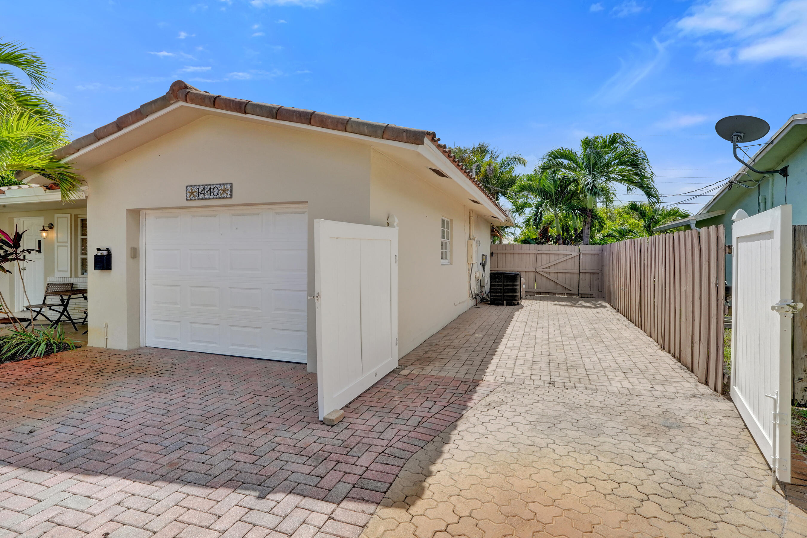 1440 Southeast 4th Court Deerfield Beach, FL 33441 - Photo 24 of 25 a view of house with backyard and trees