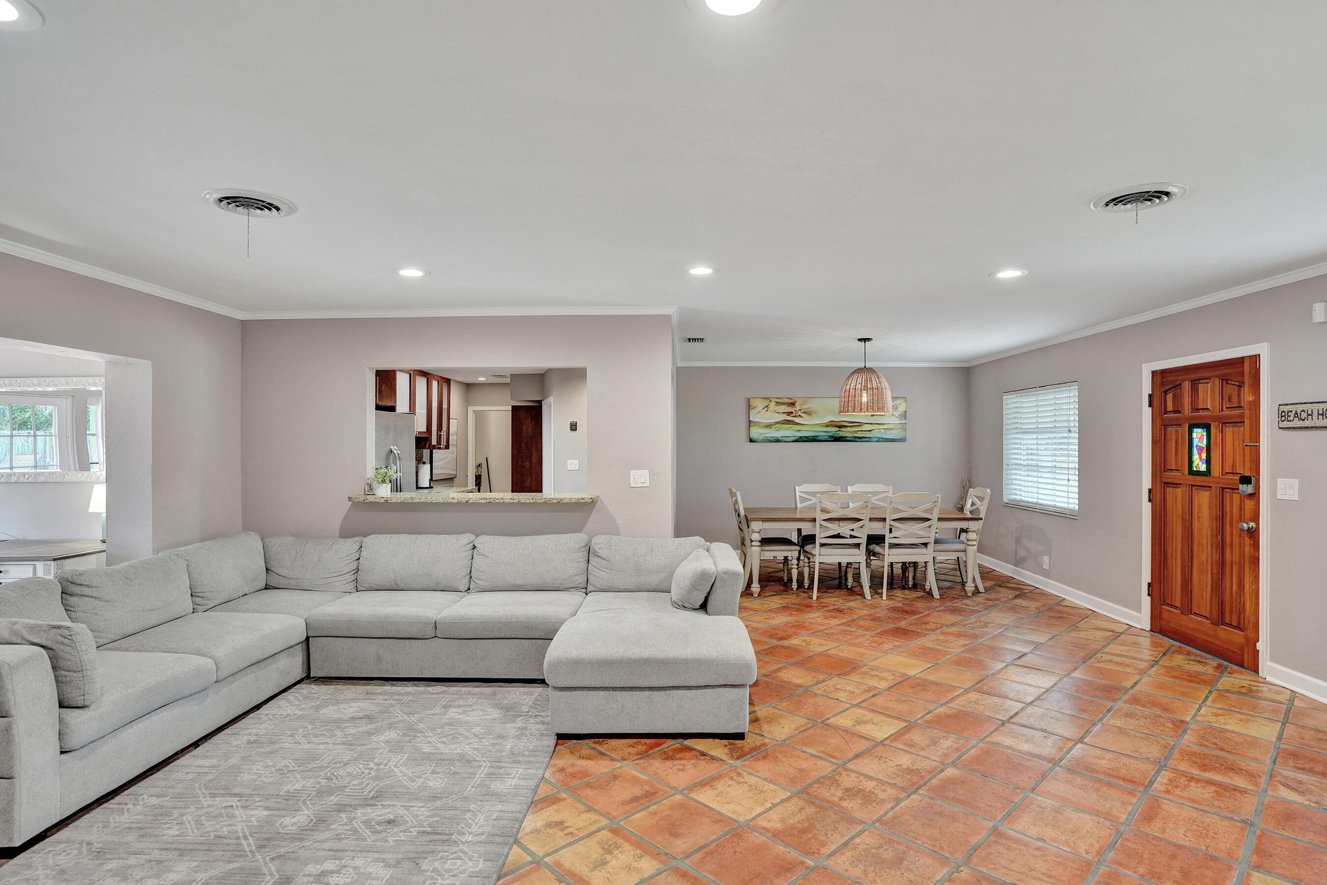 1440 Southeast 4th Court Deerfield Beach, FL 33441 - Photo 4 of 25 a living room with furniture and view of kitchen