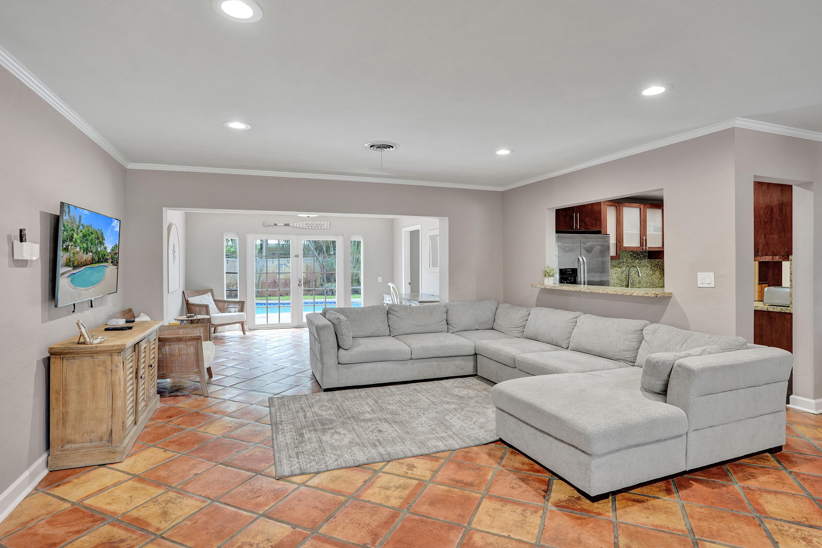 1440 Southeast 4th Court Deerfield Beach, FL 33441 - Photo 5 of 25 a living room with furniture and a flat screen tv