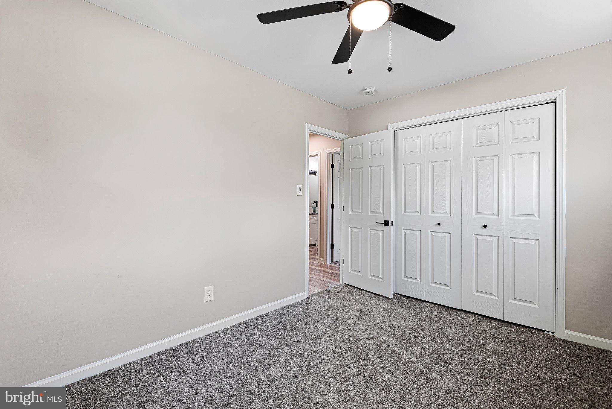 1010 Stinsford Road Newark, DE 19713 - Photo 18 of 30 an empty room with chandelier fan