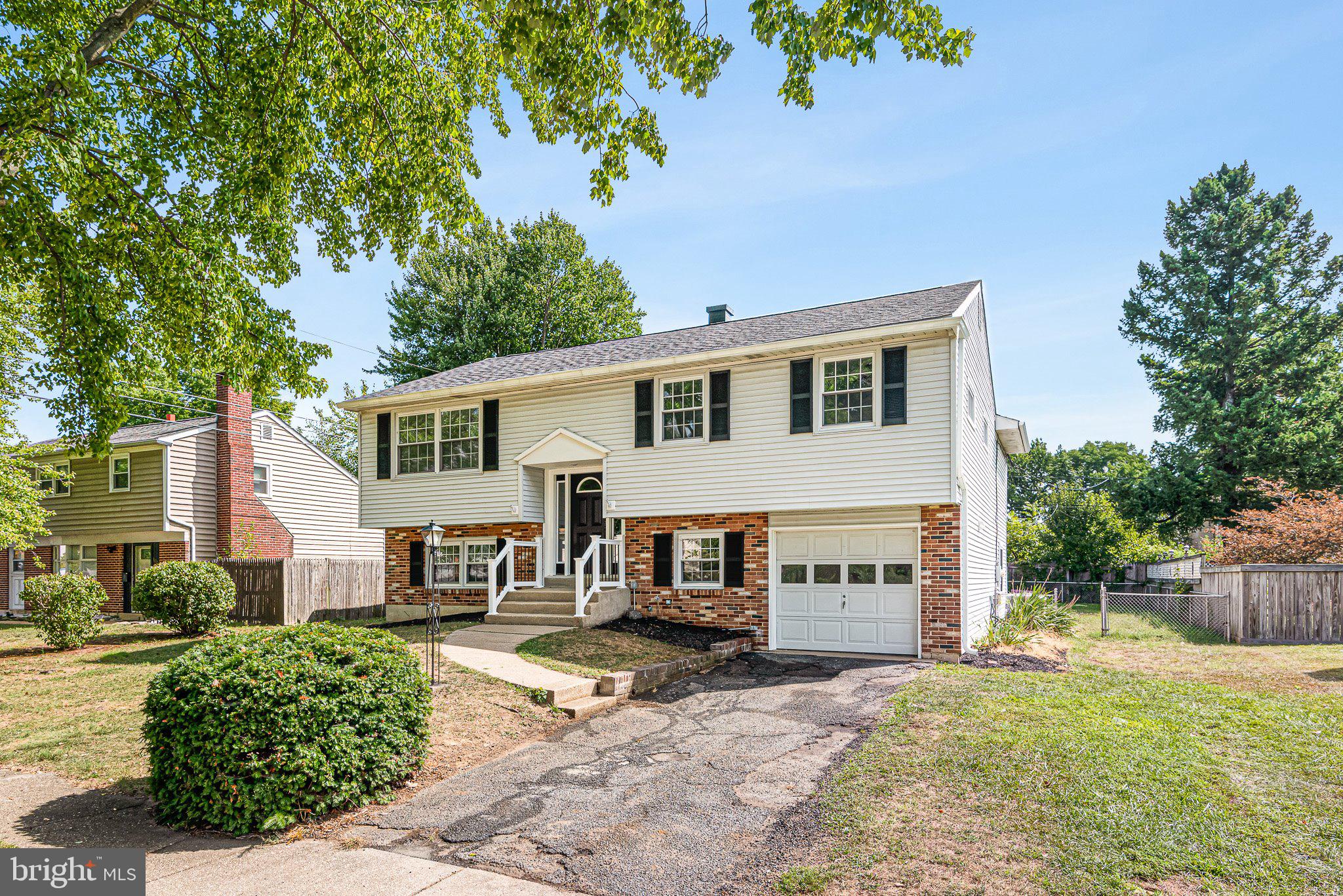 1010 Stinsford Road Newark, DE 19713 - Photo 2 of 30 a front view of a house with a yard and garage