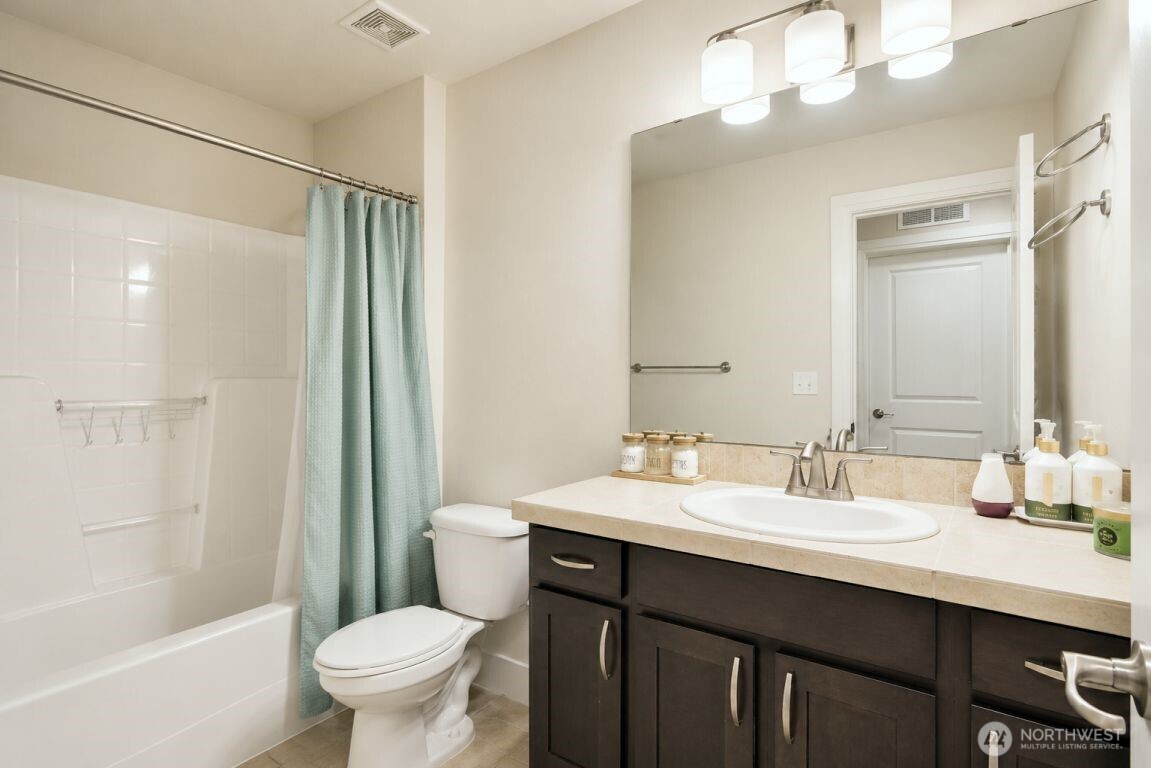 19607 25th Drive Southeast Bothell, WA 98012 - Photo 21 of 30 a bathroom with a double vanity sink toilet and shower
