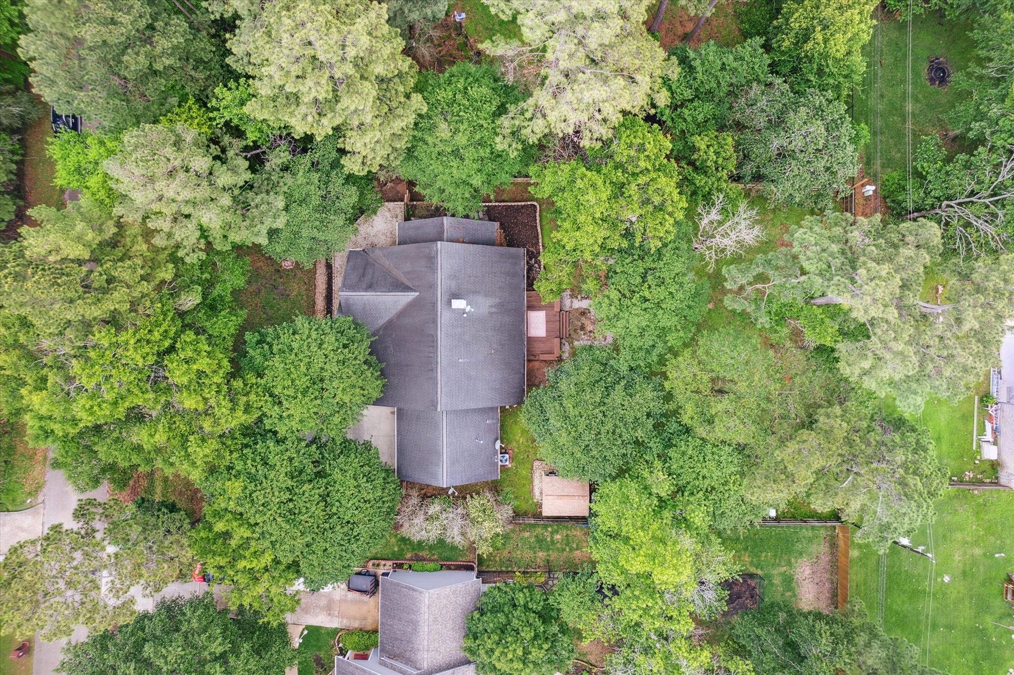 2420 Canter Lane Conroe, TX 77384 - Photo 22 of 24 an aerial view of a house with outdoor space and trees all around