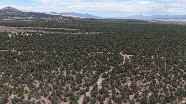 St, Unit 1 & 2 Modena, UT 84753 - Photo 10 of 69 Expansive undeveloped land featuring a natural tree canopy and distant mountain formations