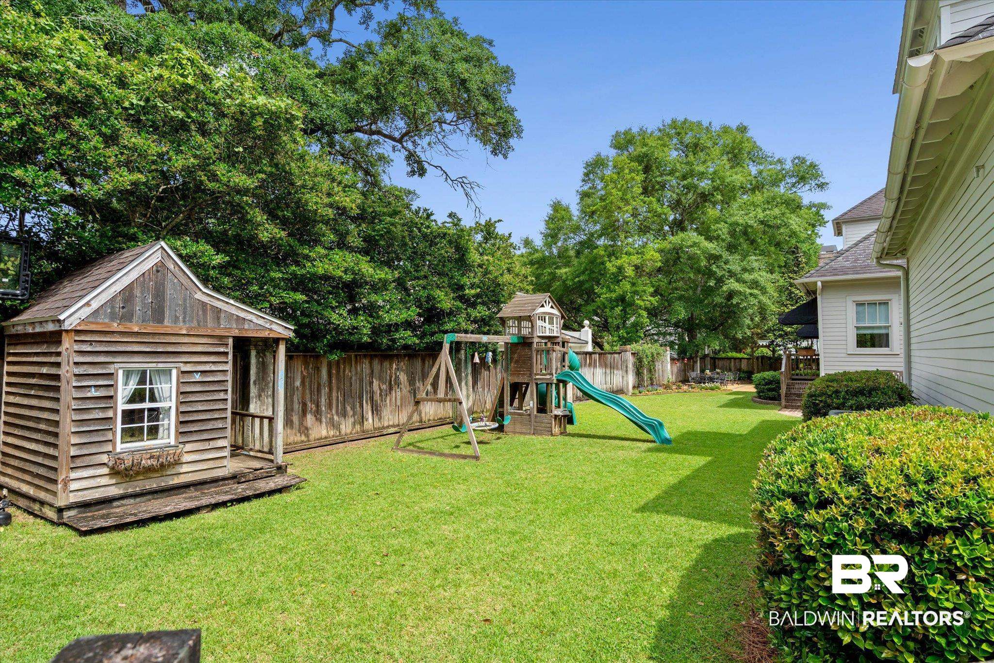 3813 Austill Lane Mobile, AL 36608 - Photo 31 of 37 Expansive backyard featuring a manicured lawn, established privacy fencing, and mature trees