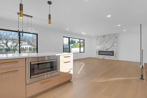 a kitchen with stove cabinets and refrigerator