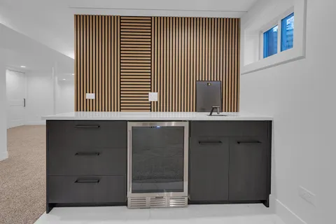 a bedroom with bed and a night stand