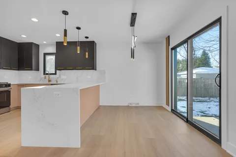 a bathroom with a sink a large mirror and a shower