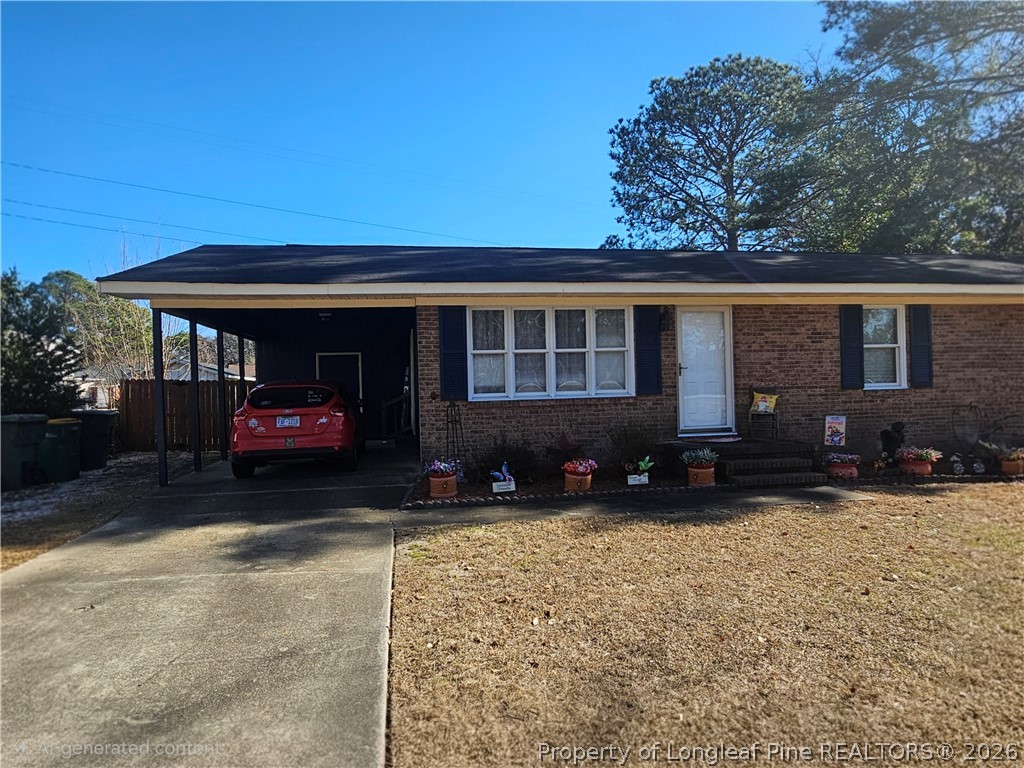 4547 Legion Road Hope Mills, NC 28348 - Photo 28 of 28 a view of a house with a yard