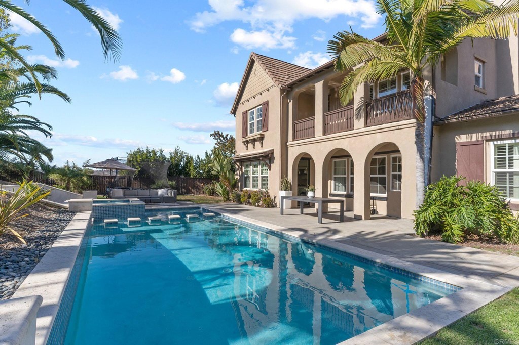 2428 Lapis Road Carlsbad, CA 92009 - Photo 1 of 1 a view of a house with backyard porch and sitting area