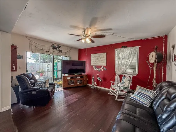 a dining room with furniture and wooden floor